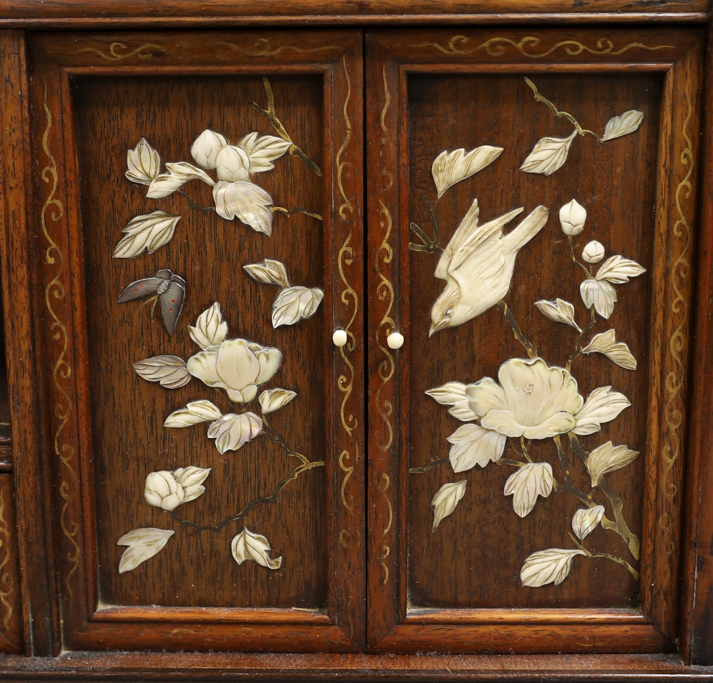 A Japanese hardwood and Shibayma decorated table cabinet, Meiji period, 56cm